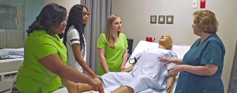 New grad RNs at Phoebe in a training session at the simulation center