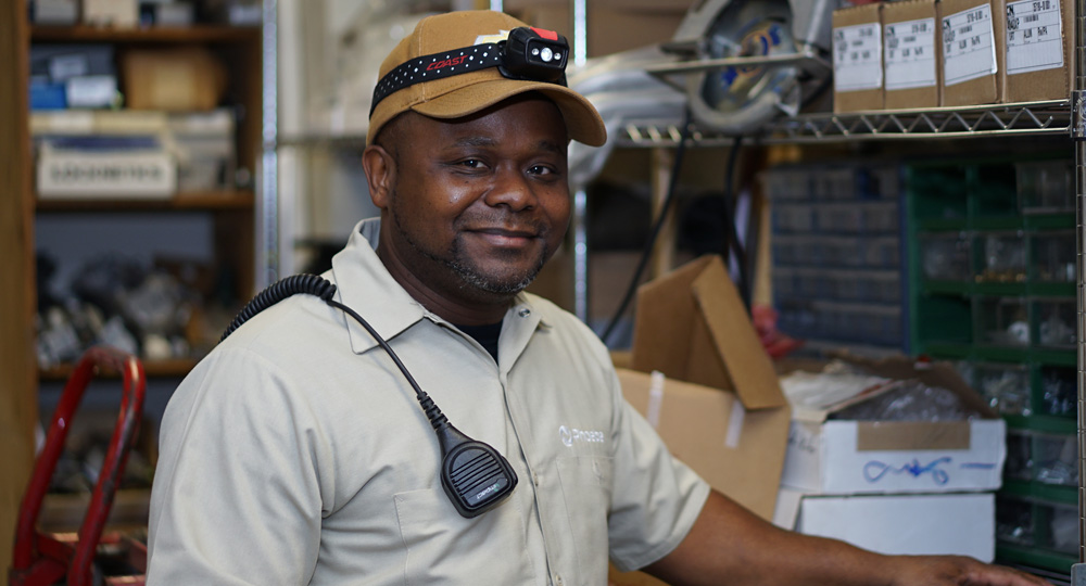 Smiling facilities employee in cap at Phoebe
